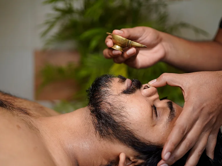 Authentic Kerala Ayurveda oil treatment at Ayurgreen Hospital