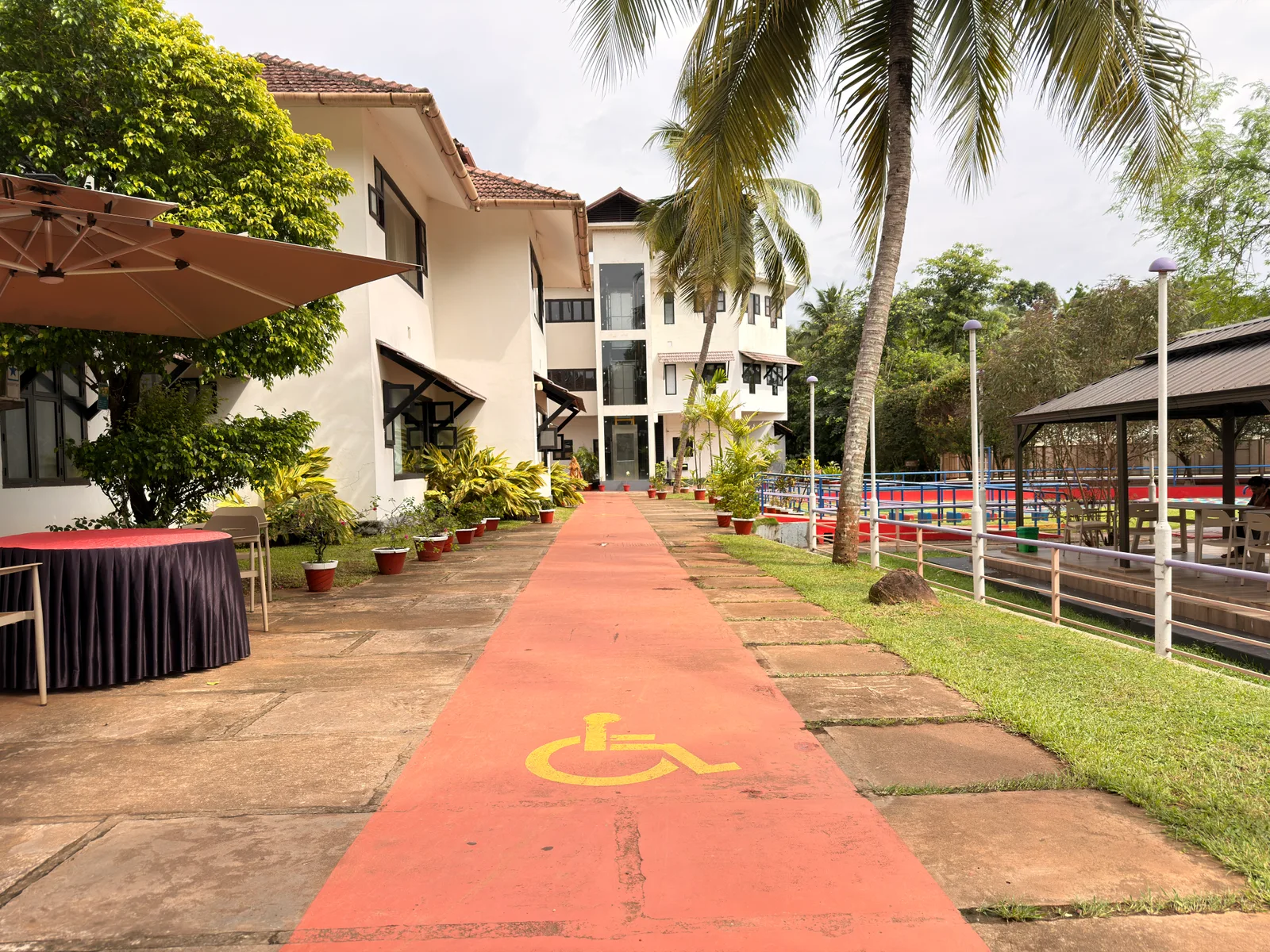 Zero-barrier architecture facilitating effortless movement for wheelchair users 100% barrier-free hospital campus architecture with zero-step threshold doorways